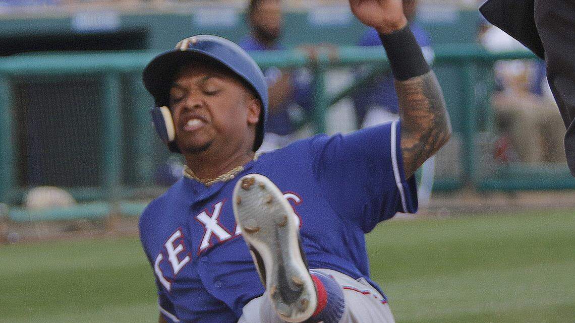 Texas Rangers designated hitter Willie Calhoun scores from first base on a single by outfielder Scott Heineman in the sixth inning as the Texas Rangers play the Los Angeles Dodger at in Glendale, Arizona in spring training, Tuesday, February 27, 2018.