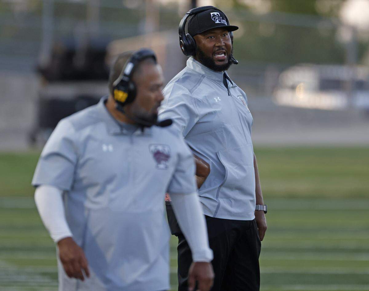 Mansfield Timberview head coach Jacody Coleman talks to another coach during a game Sept. 4.