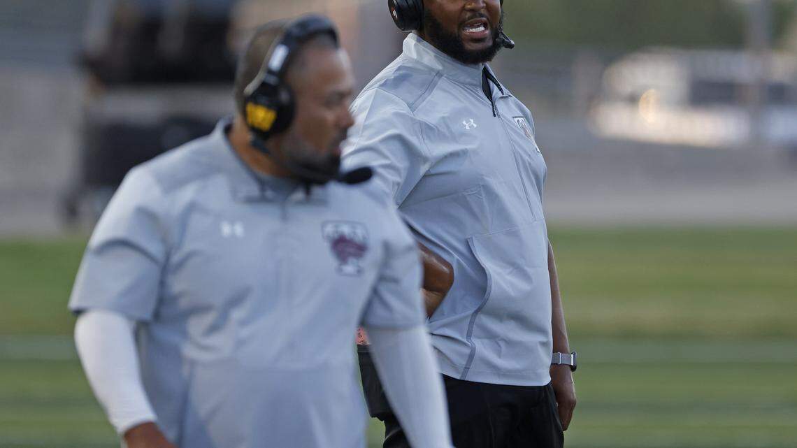 Timberview head coach Jacody Coleman talks to another coach during the first half of a UIL football game at Vernon Newsom Stadium in Mansfield, Texas, Thursday, Sept. 04, 2025.