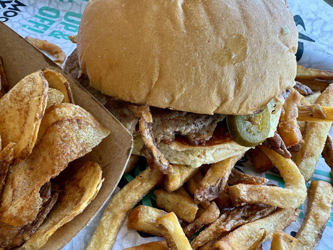 A jalapeno turkey burger with both fries and chips at Mooyah, Sept. 13, 2025, in Fort Worth, Texas.