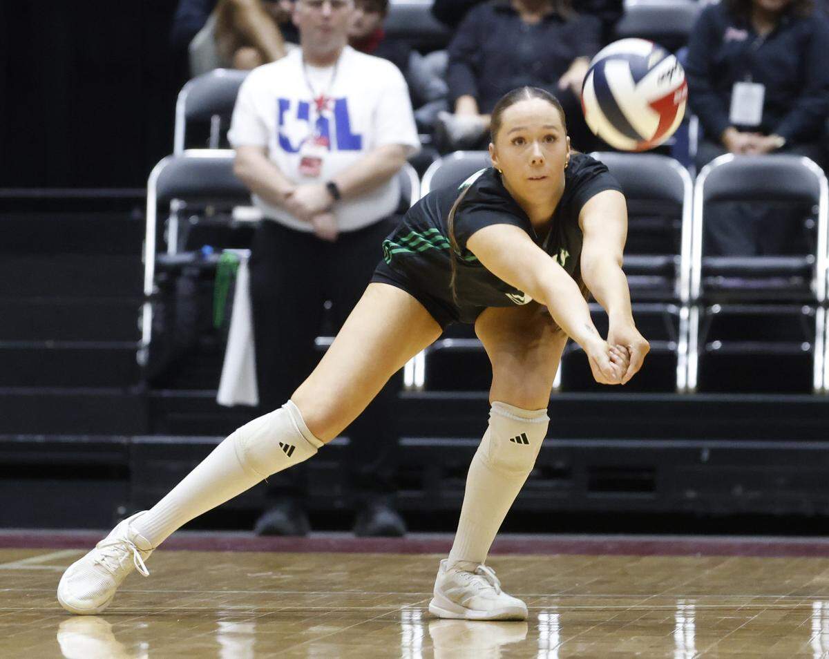 Southlake Carroll outside hitter Teddy-Raye Ewers (21) digs out the ball against Austin during the first set of the UIL Class 6A Division II state volleyball championship game Saturday Nov. 22, 2025 at Curtis Culwell Center in Garland, Texas.