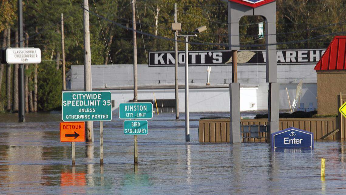 Food waters cover signs and buildings on U.S. Hwy. 70 in Kinston, N.C., on Oct. 14, 2016.  The Neuse River crested there after Hurricane Matthew and could again this weekend if Hurricane Florence doesn’t turn west.