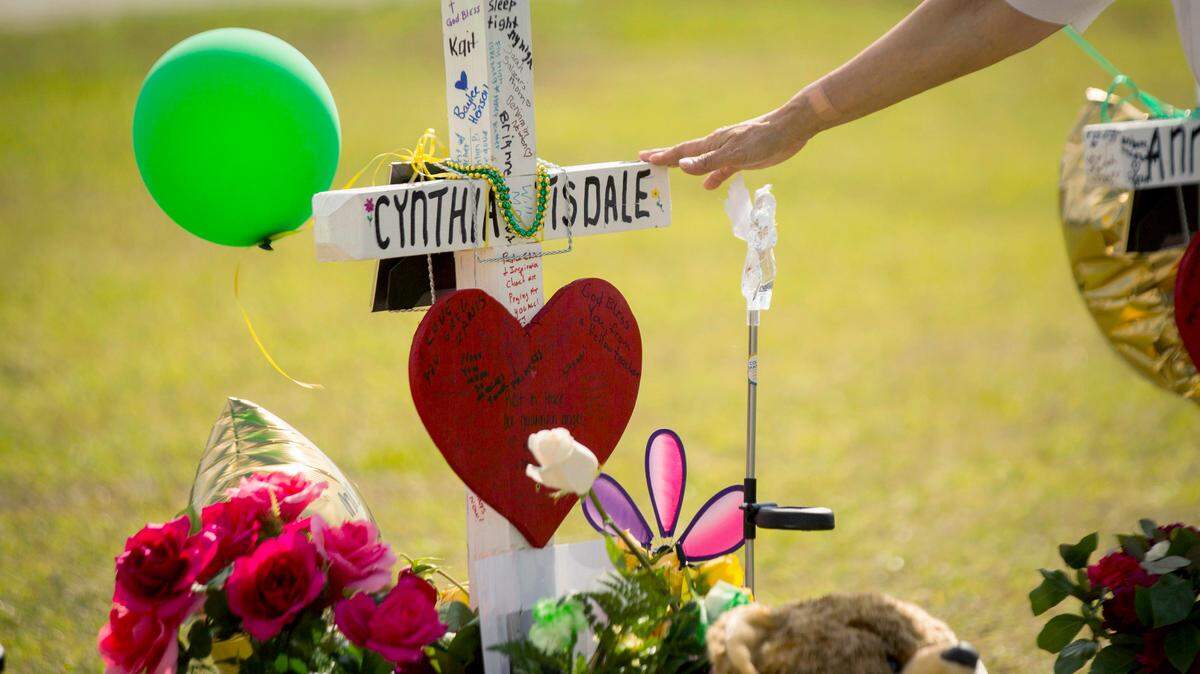 A cross honored Santa Fe High School substitute teacher Cynthia Tisdale who was killed during a shooting at the school in Santa Fe, Texas.