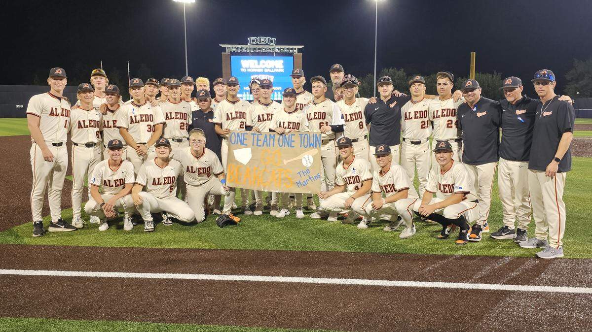 Aledo players hold up a sign supporting the Martin family following a Game 1 win over McKinney North at DBU’s Horner Ballpark in Dallas, Texas, Thursday, May 28, 2026.