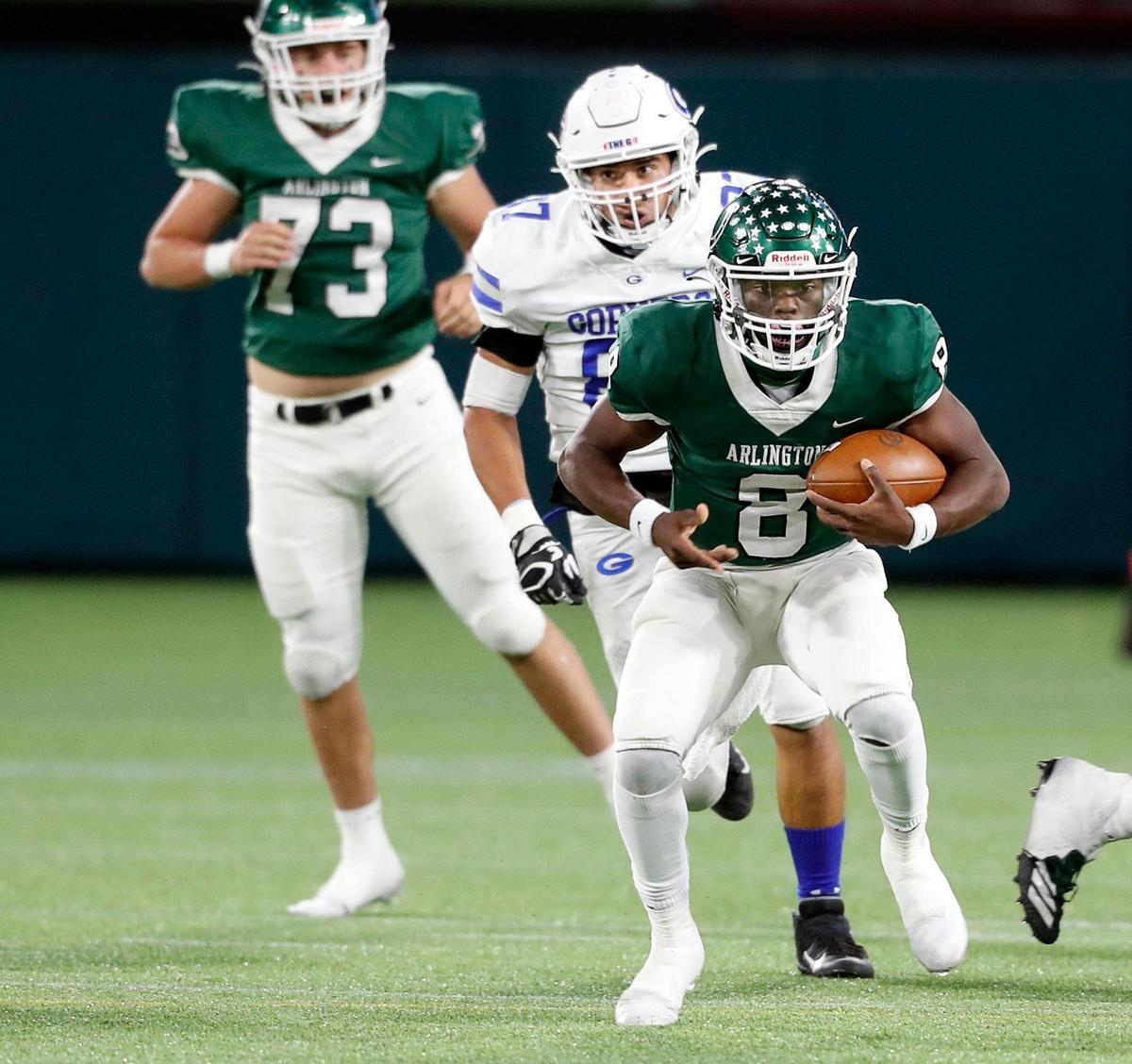 Arlington quarterback Kris Sims (8) brings the ball upfield on a keeper during a high school football game at Globe Life Park in Arlington Texas, Friday, Oct. 23, 2020. After two quarters of play Arlington led Grand Prairie 21-3.(Special to the Star-Telegram Bob Booth)
