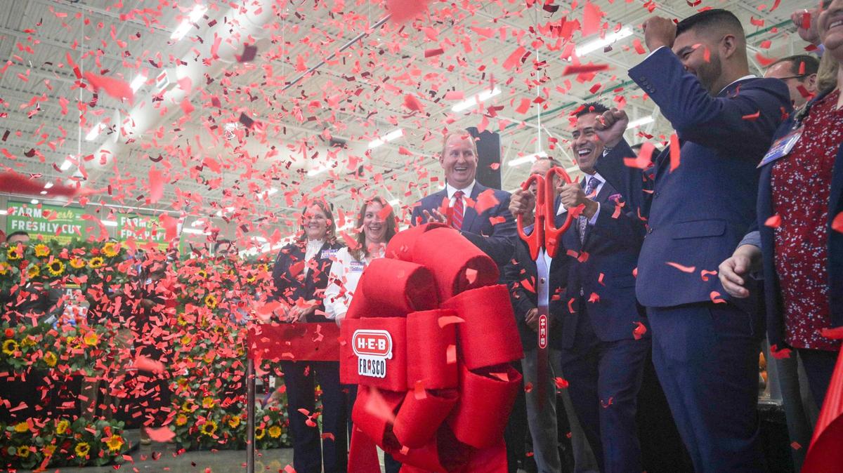 Eli Daniel, general manager of H-E-B’s new Frisco location, cuts a ribbon to celebrate the store’s opening Sept. 20. Two H-E-Bs are coming to Tarrant County.