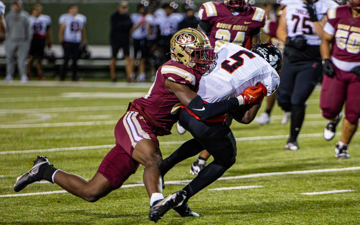 Amarillo Tascosa’s Za’Cory Fisher is brought down by a Saginaw defender in a Class 5A Division 1 area-round game on Friday, Nov. 22, 2024 at Memorial Stadium in Wichita Falls, Texas. Tascosa defeated Saginaw 35-13.