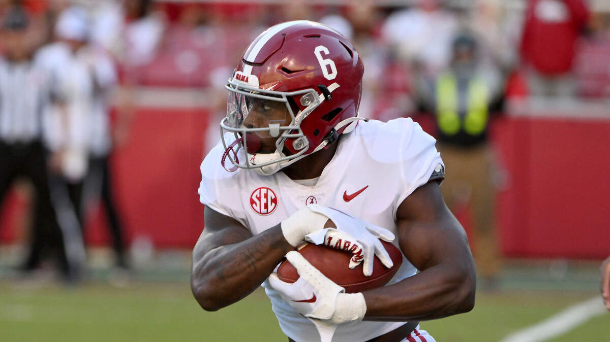 Alabama running back Trey Sanders (6) runs the ball against Arkansas during an NCAA college football game Saturday, Oct. 1, 2022, in Fayetteville, Ark. (AP Photo/Michael Woods)