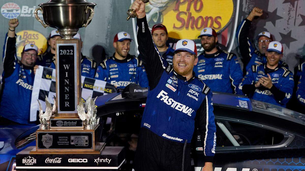 Chris Buescher celebrates with his trophy and sword after winning a NASCAR Cup Series auto race at Bristol Motor Speedway on Sept. 17.