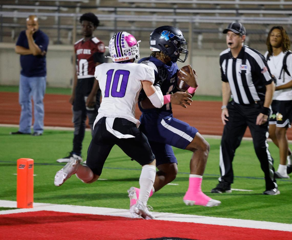 Wyatt quarterback Jorvorskie Lane (13) crosses the goal line for the Chapparals only score of the first half during a District 4-5A Division 1 football game at Herman Clark Stadium in Fort Worth, Texas, Thursday, Oct. 24, 2024.