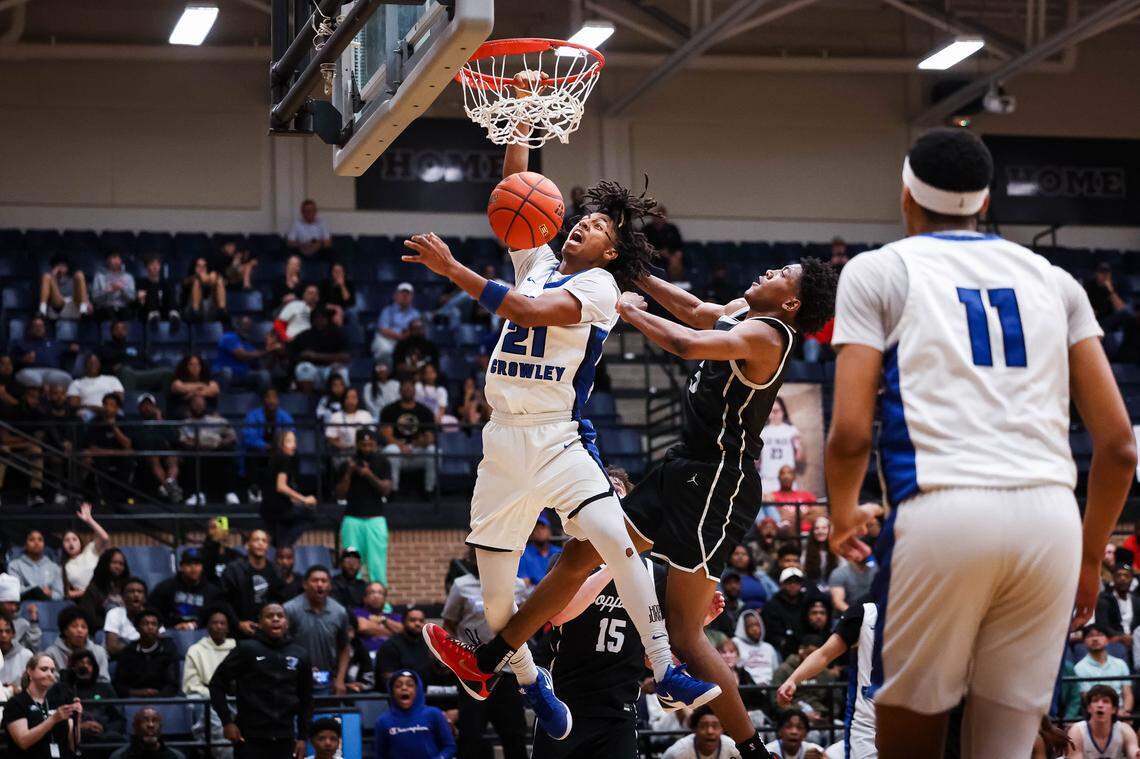 North Crowley guard Jonathan Fox (21) screams in reaction after making a dunk on a Coppell defender in the UIL 6A D1 regional semifinal at Timberview High School in Mansfield, Texas, Tuesday, March 3, 2026.