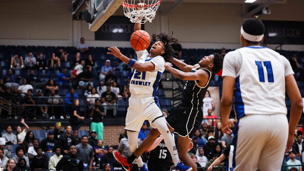 North Crowley guard Jonathan Fox (21) screams in reaction after making a dunk on a Coppell defender in the UIL 6A D1 regional semifinal at Timberview High School in Arlington, Texas, Tuesday, March 3, 2026.