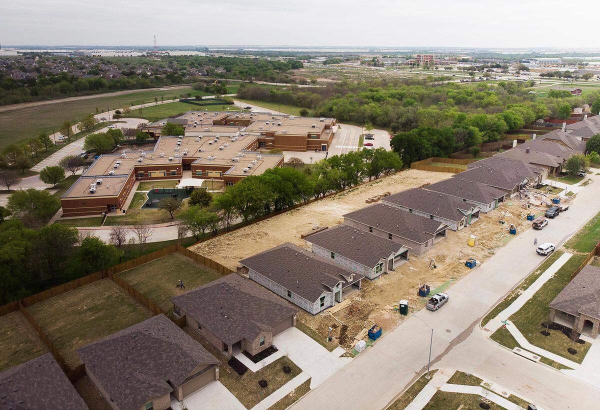 A new housing development is under construction near Clara Love Elementary, part of Northwest ISD, in Justin on Wednesday, March 30, 2023. Northwest ISD has added 15,000 students since 2010. Its nearly $2 billion bond will go toward a high school, a middle school, four elementary schools and four early childhood centers.