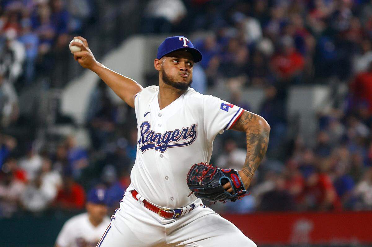 Rangers pitcher Jonathan Hernández throws during their game against the Phillies on March 30, 2023, at Globe Life Field in Arlington. Texas beat Philadelphia 11-7.