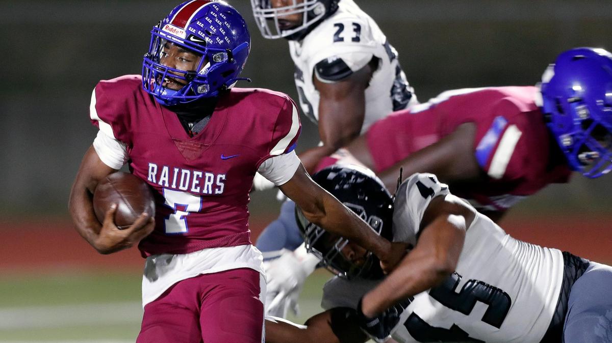 Southwest quarterback Caleb Ollison (7) stiff arms South Hills defensive lineman Courtlin Pumphrey on the way to their second touchdown during a high school football game at Clark Stadium in Fort Worth, Texas, Friday, Nov. 13, 2020. Southwest led South Hills 41-0 at the half. (Special to the Star-Telegram Bob Booth)