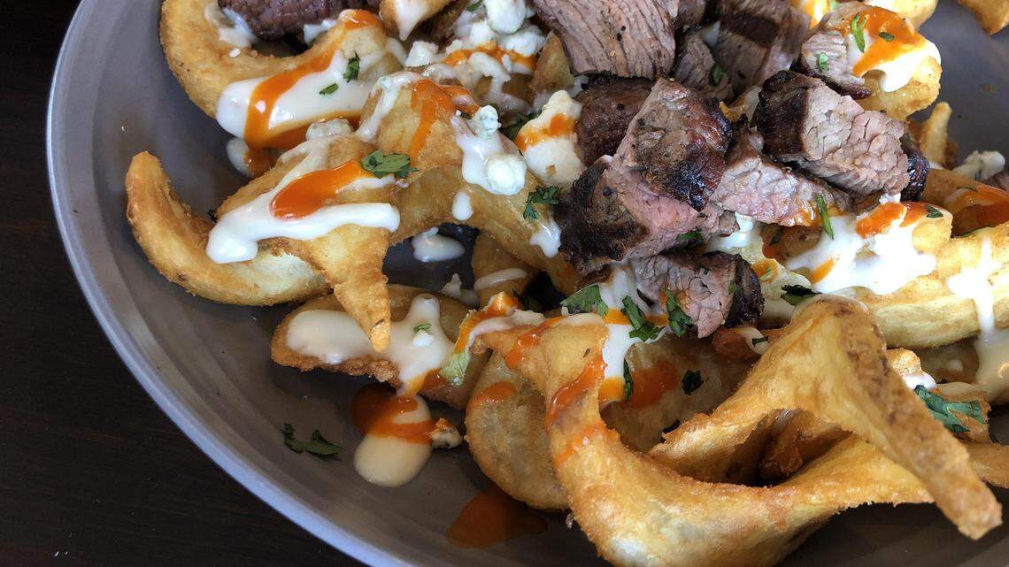 The Rim in Burleson serves curly potato wedges (aka Sidewinder Fries) with Gorgonzola and Buffalo sauce.