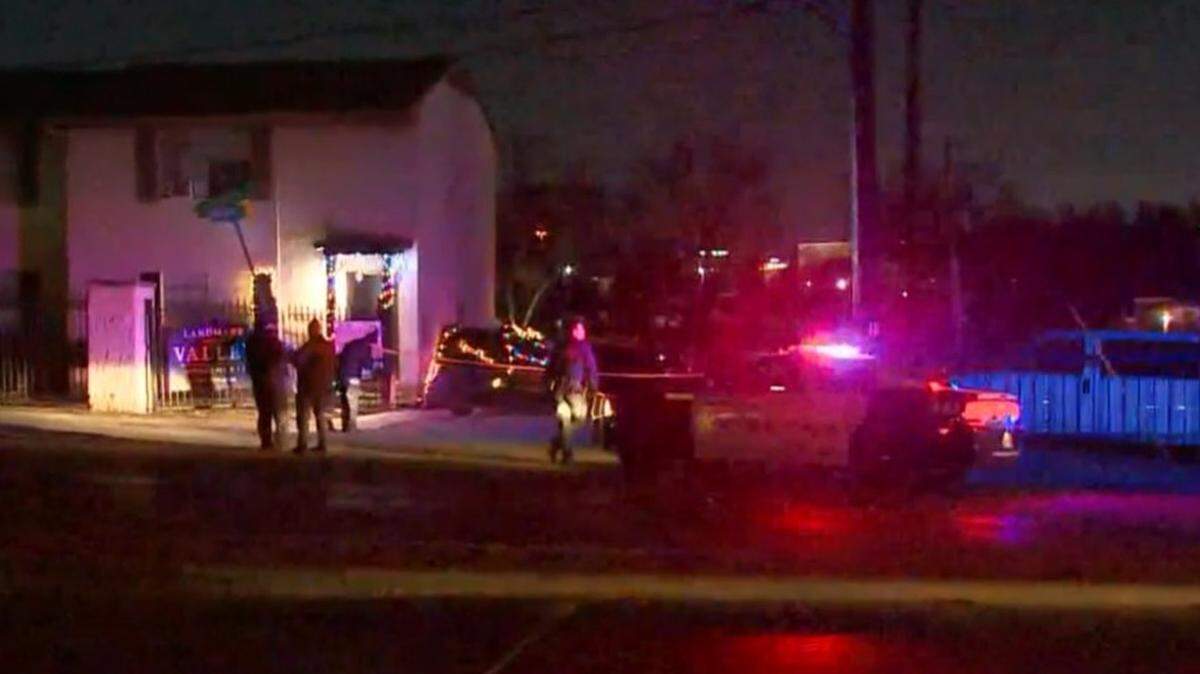 Two men and a woman were found shot to death early Friday in a Dallas parking lot, Dallas police said. Two other men also were injured in the shooting.