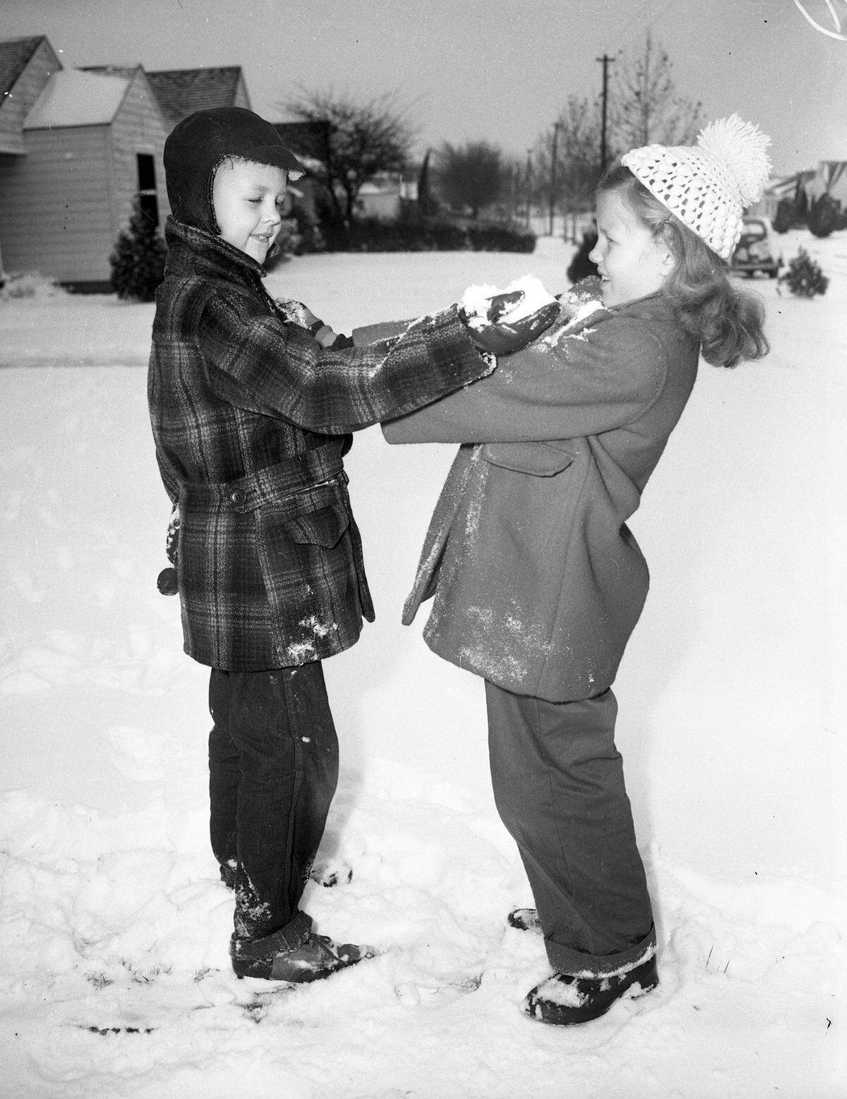 Dec. 31, 1946: “Janelle Hightower, 7, and Dick Olmstead, 8, playing in snow. Dick is shown rubbing a handful of snow into Janelle’s face as she tries to push him away with snow in her hands. Both are laughing and smiling and Janelle describes the fight as ‘fun.’ ... Janelle is the daughter of Mr. and Mrs. Cato Hightower, and Dick is the son of Mr. and Mrs. M. B. Olmstead.”