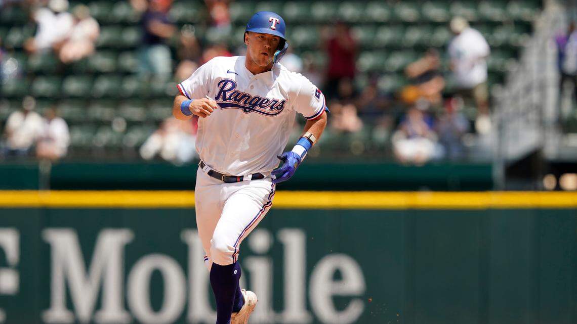 Texas Rangers’ Josh Jung runs the bases after hitting a two-run homer during the fifth inning against Arizona on Wednesday at Globe Life Field. It was one of eight home runs hit at the ballpark on Wednesday.