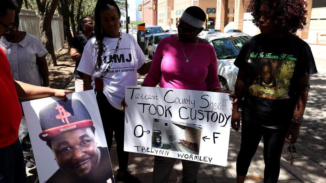 Cassandra Johnson, second from right, and others protest outside the Tarrant County Jail on July 25. Johnson’s son, Trelynn Wormley, 23, died from an overdose, the medical examiner determined.