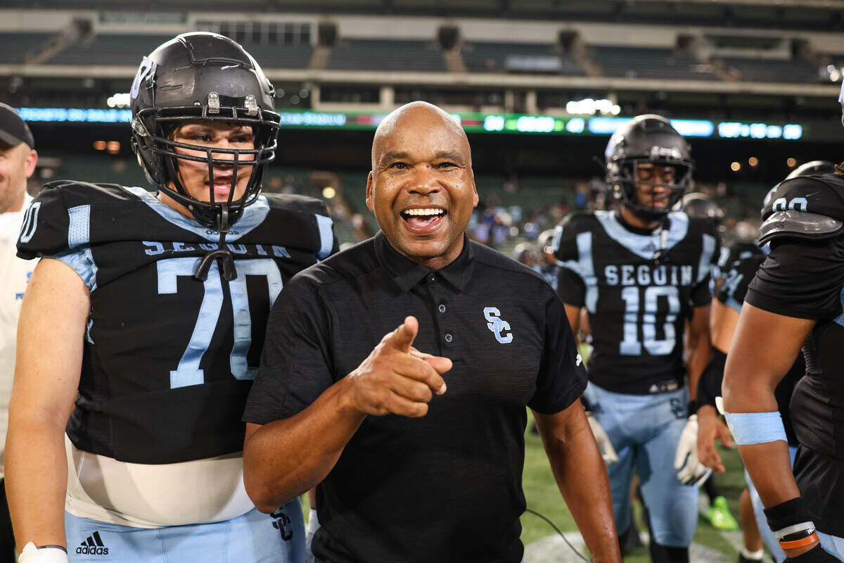 Arlington Seguin head coach Joe Gordon smiles and points after Arlington Seguin beat Red Oak 41-34 in a non-district game at Choctaw Stadium in Arlington, Texas on Sept. 4, 2025.