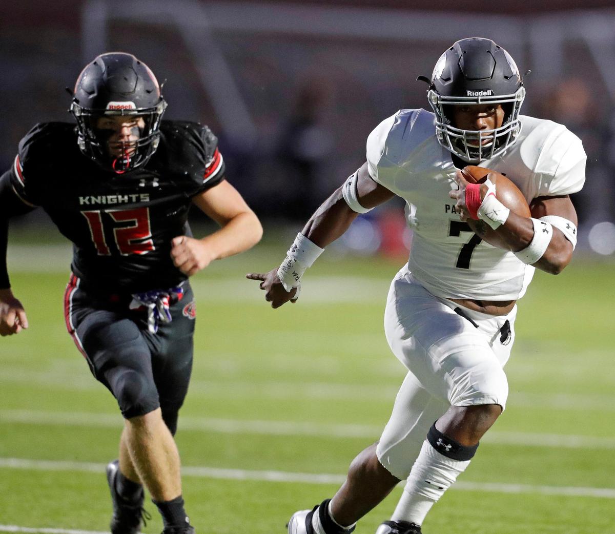 Pantego running back Myion Hicks (7) outruns Dallas Covenant defensive end Hayden Anderson (12) fofr yardage during a high school football game at Dallas Covenant in Dallas, Texas, Friday, Oct. 16, 2020. Pantego lrf 21-0 at the half. (Special to the Star-Telegram Bob Booth)