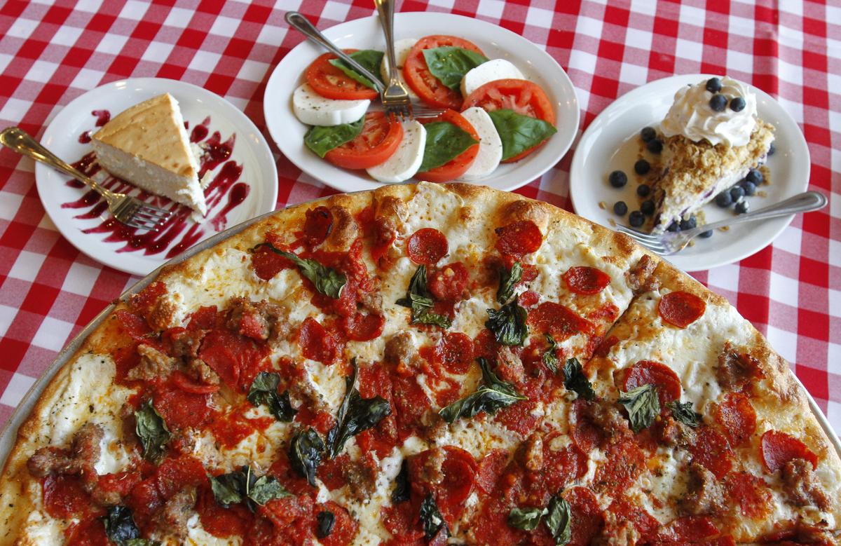 New York style cheesecake, a caprese salad, and a blueberry cobbler cheesecake with a Pepperoni, sausage and basll pizza from Grimaldi’s