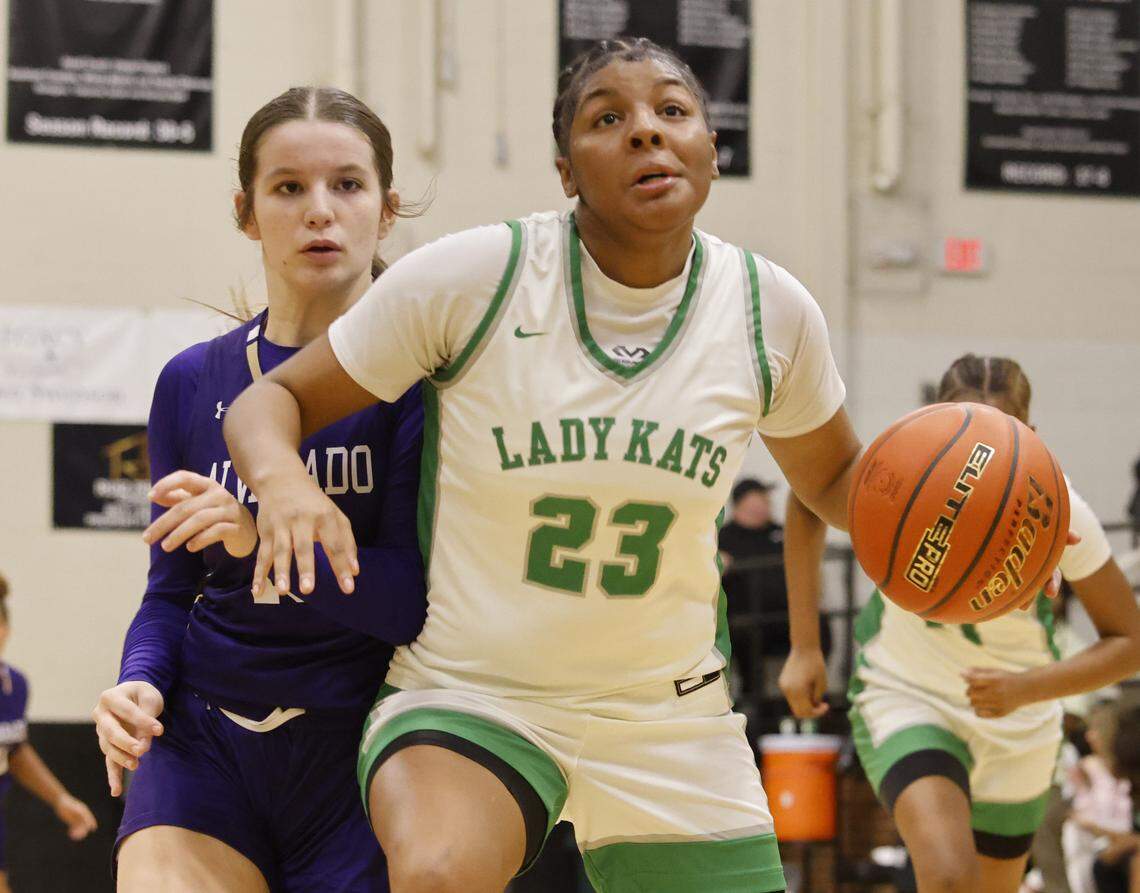 Kennedale forward Ciara Taylor (23) drives against Alvarado guard Olivia Simpson (15) during the first half of a Uil basketball game between Alvarado and Kennedale at Kennedale High School in Kennedale, Texas, Tuesday Jan. 13, 2026
