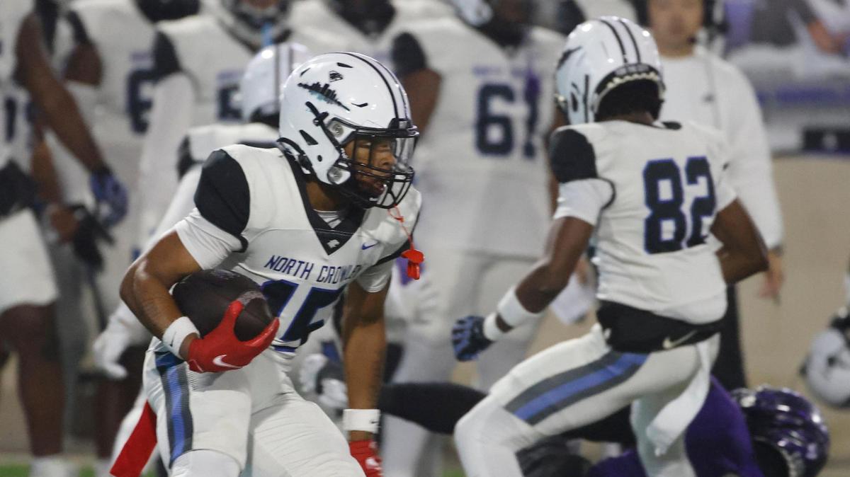 North Crowley quarterback Demarcus Harris (15) looks for running room down the right side during a UIL District 3-6A football game at Crowley ISD Multi-Purpose Stadium in Fort Worth, Texas, Tuesday, Nov. 07, 2024.
