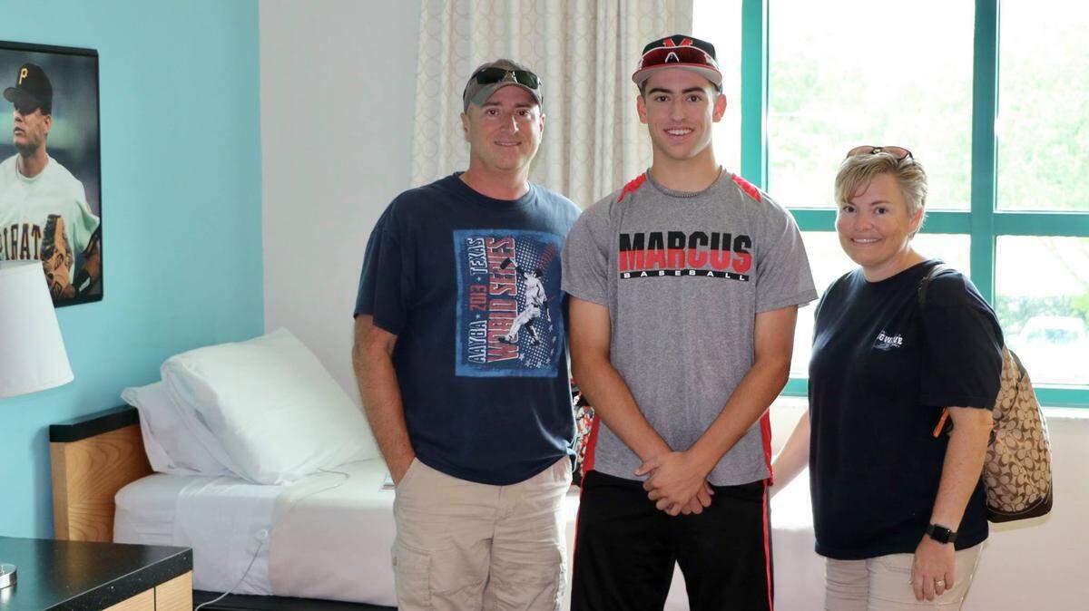Austin Salyer (center) in a photo with his parents, Rodney and Bonnie. Austin died in 2021.