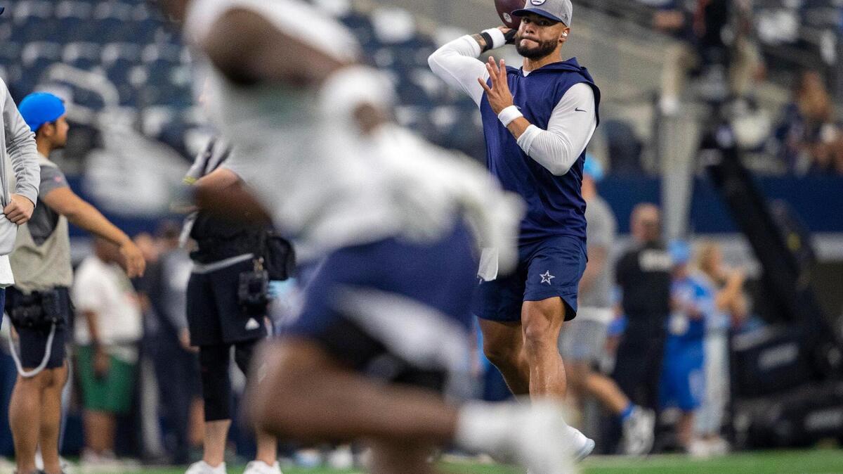 Dallas Cowboys quarterback Dak Prescott warms up before their game against the Detroit Lions at the AT&T Stadium in Arlington on Sunday, Oct. 23, 2022.