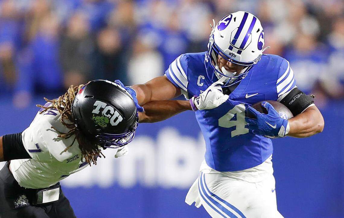 PROVO, UT - NOVEMBER 15: LJ Martin #4 of the Brigham Young Cougars gets face masked by Channing Canada #7 of the Texas Christian University Horned Frogs during the first half of their game at LaVell Edwards Stadium on November 15, 2025 in Provo, Utah. (Photo by Chris Gardner/Getty Images)