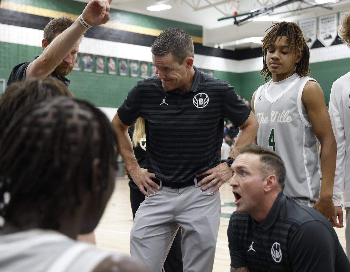 Birdville assistant coach Sean Tippett listens to head coach Anthony Holman talk to the team during a timeout against Denton Ryan in the second half of a UIL basketball game at Birdville High School in North Richland Hills, Texas, Tuesday Feb. 17, 2026.