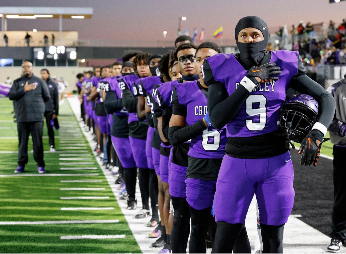 Crowley defensive end Priest Ashe (9) and team mates stand for the National Anthem before the first half of a UIL high school football game at Crowley ISD Multi-Purpose Stadium in Fort Worth, Texas, Thursday, Nov. 02, 2023.