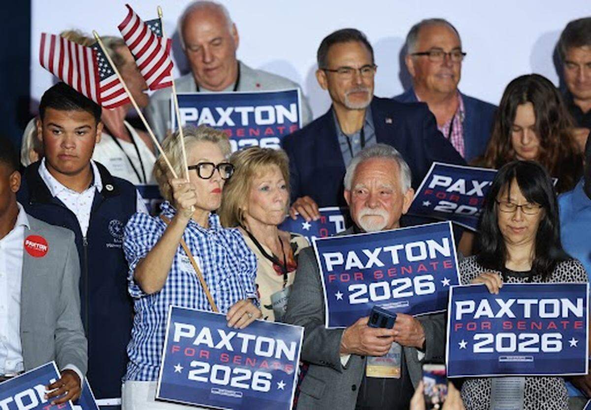 Supporters of Attorney General Ken Paxton celebrate at a Plano election night watch party as the May 26 U.S. Senate primary runoff is called in his favor at 8 p.m.