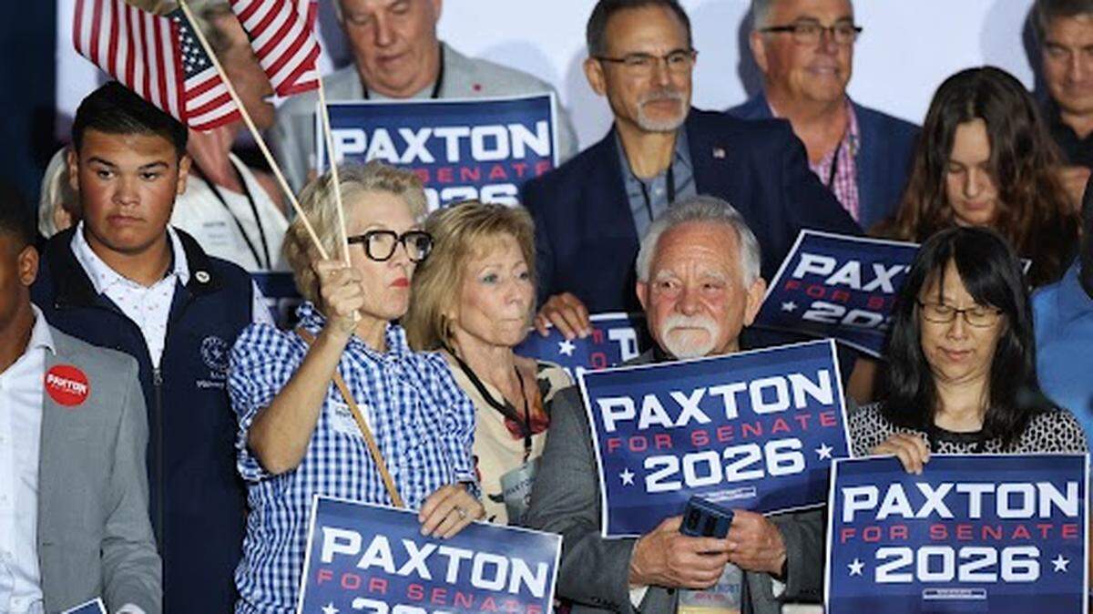 Supporters of Attorney General Ken Paxton celebrate at a Plano election night watch party as the May 26 U.S. Senate primary runoff is called in his favor at 8 p.m.