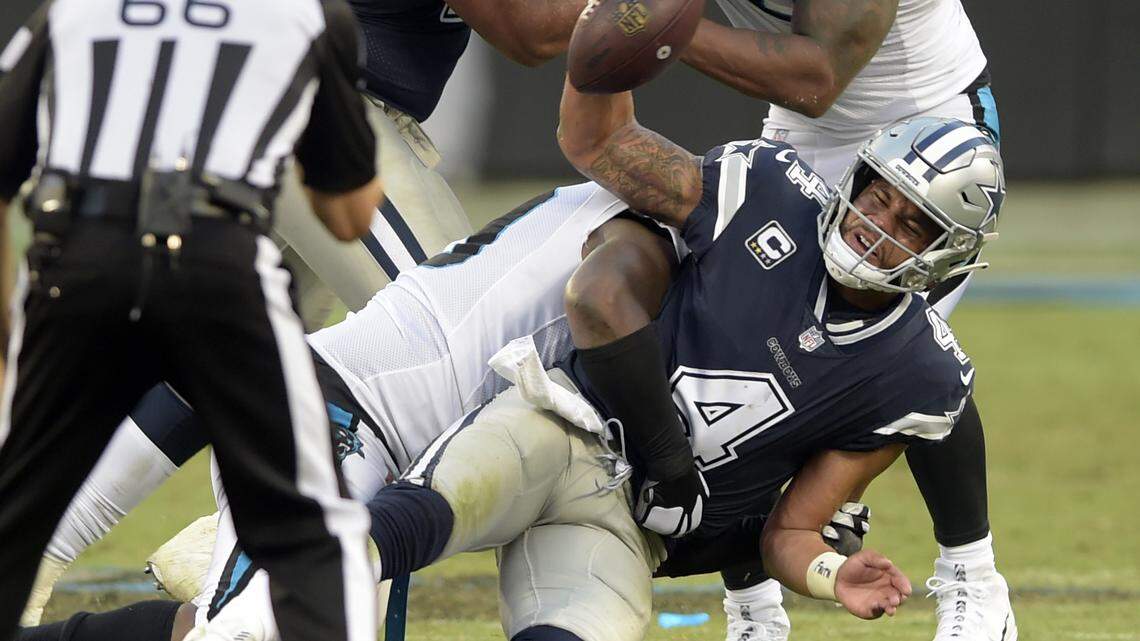 Dallas Cowboys’ Dak Prescott (4) passed for 170 yards in the team’s 16-8 loss against Carolina on Sunday. He was also sacked six times.