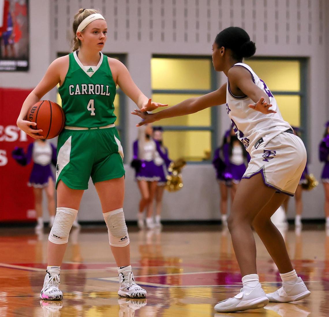 Southlake Carroll guard Brittney Flexer (4) waits to set up a play against Keller Timber Creek forward Deja Lumsden (22) during the second half of a 6A Region I Regional Quarter-Finals Girls Basketball playoff game played on Thursday, February 25, 2021 at Justin Northwest High School. (Steve Nurenberg Special to the Star-Telegram)