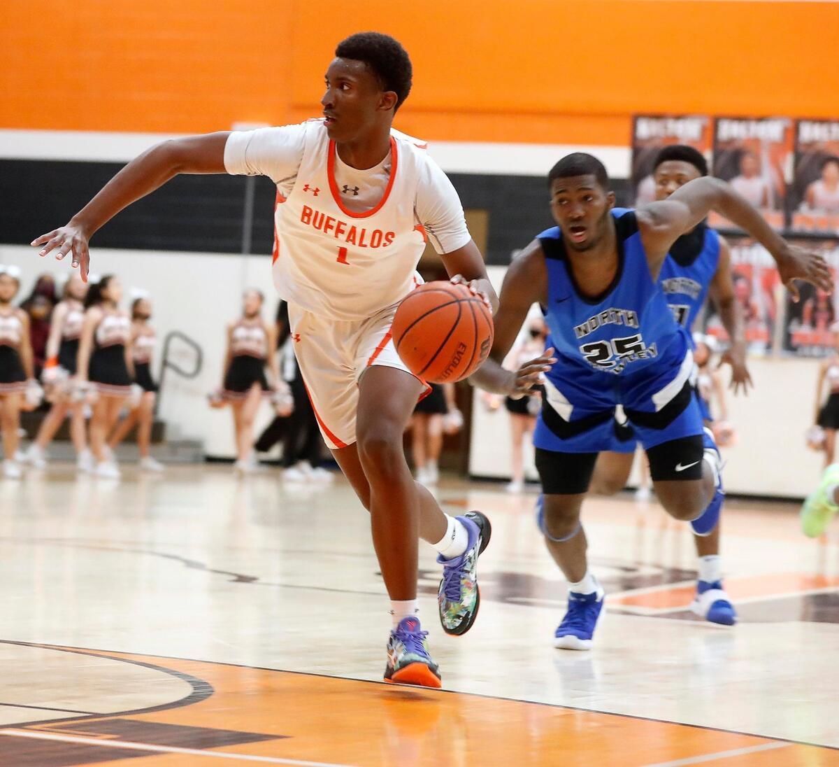 Haltom forward Paul Bizimana (1) drives into the key during a District 3-6A Bi-district basketball game at Haltom High School in Haltom City, Texas, Friday, Feb. 12, 2021. North Crowley defeated Haltom 55-45. (Special to the Star-Telegram Bob Booth)