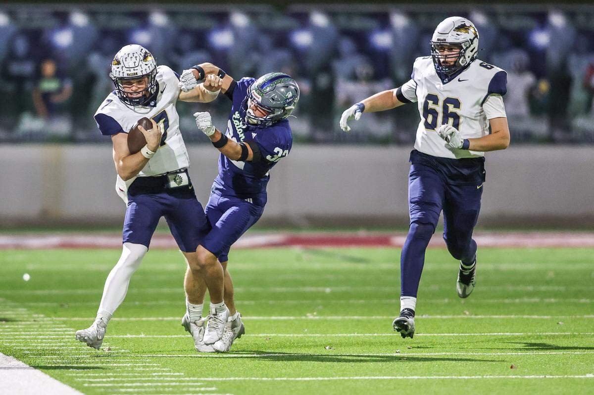 Keller quarterback Brock Burkekett is hit out of bounds by Eaton’s Jobey Maruca at Northwest ISD Stadium in Justin, Texas, Friday, Nov. 7, 2025.