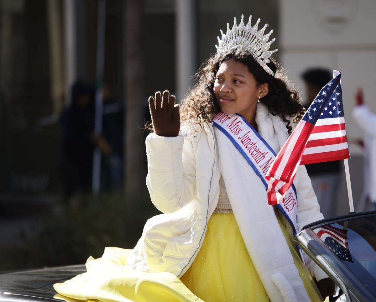 Junior Miss Juneteenth of North Texas 2025, Bailey Howell waves to the crowd during the 2026 Martin Luther King day celebration in Fort Worth, Texas, Monday Jan. 19, 2026