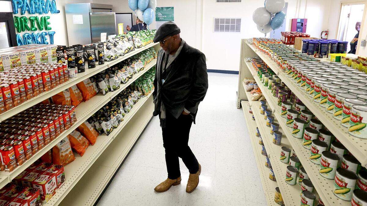 Fort Worth ISD Trustee Wallace Bridges walks down an aisle of O.D. Wyatt High School’s new on-campus grocery store available to students and their families on Wednesday, January 31, 2024, in Fort Worth. The grocery store is the fifth one opened through Texas Health Resources’ THRIVE North Texas program and the first in Fort Worth ISD.