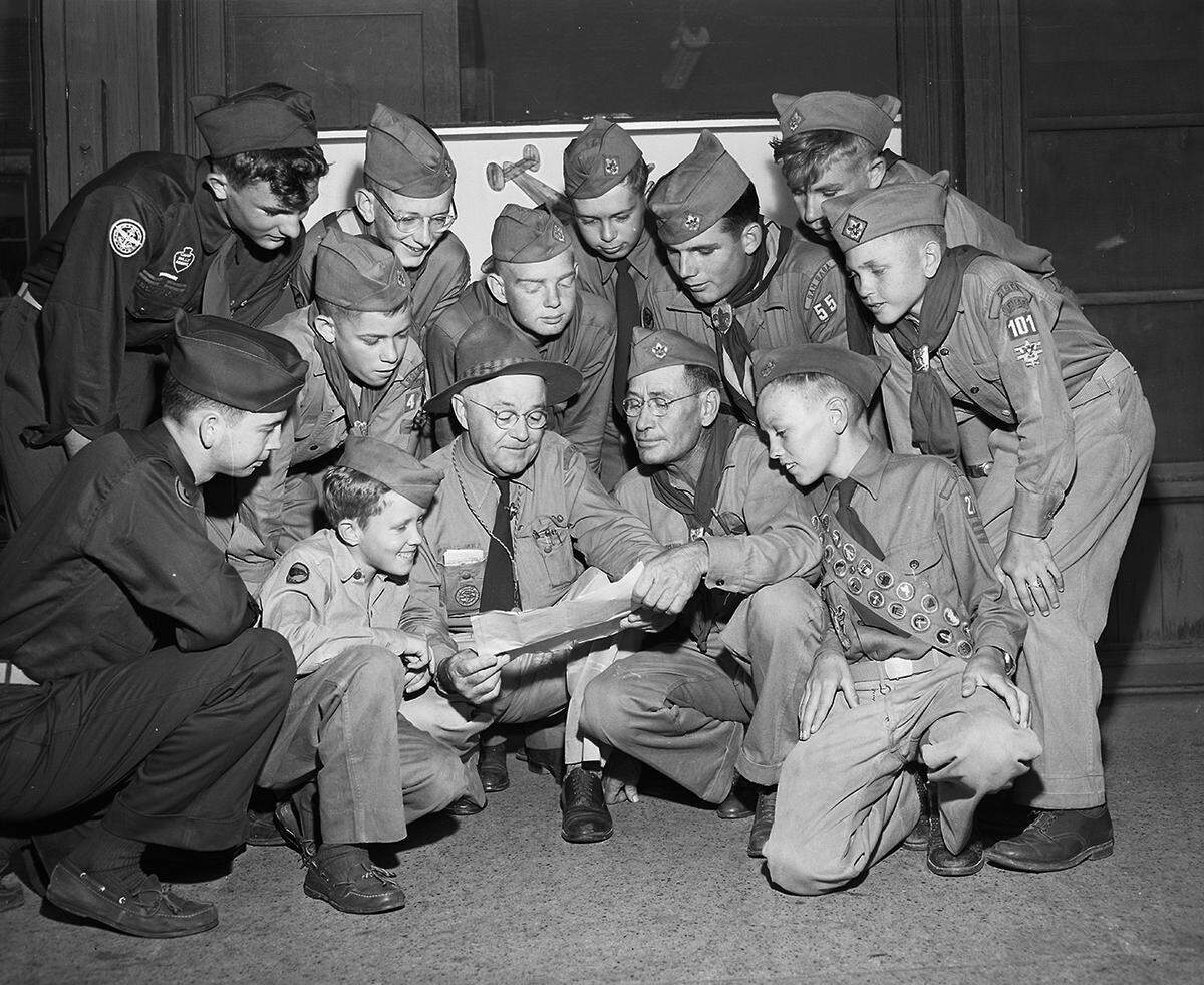 June 24, 1950: Headed for Valley Forge and National Boy Scout Jamboree, these District 9 scouts and leaders from eight Southwest and West Texas counties stopped in Fort Worth for breakfast. Crouching left to right, Joe Paul Tupin, Comanche; Jerry Shugart, Stephenville; C. L. Pouncey, Brownwood, scoutmaster of Jamboree Troop Number 26; Lee R. Teason, Richland Springs, scoutmaster of Troop Number 27, and Clyde Mathews, Bangs. Standing, left to right, Arlie Merlin McAnelly Brown, Stephenville; Ray Hudson and Lathon Jernigan, both of Goldthwaite; Merlin McAnelly and Travis Herring, both of Lometa; Tony Kirk, San Saba; David Masner, Breckenridge, and Puddy Deen, Cisco.