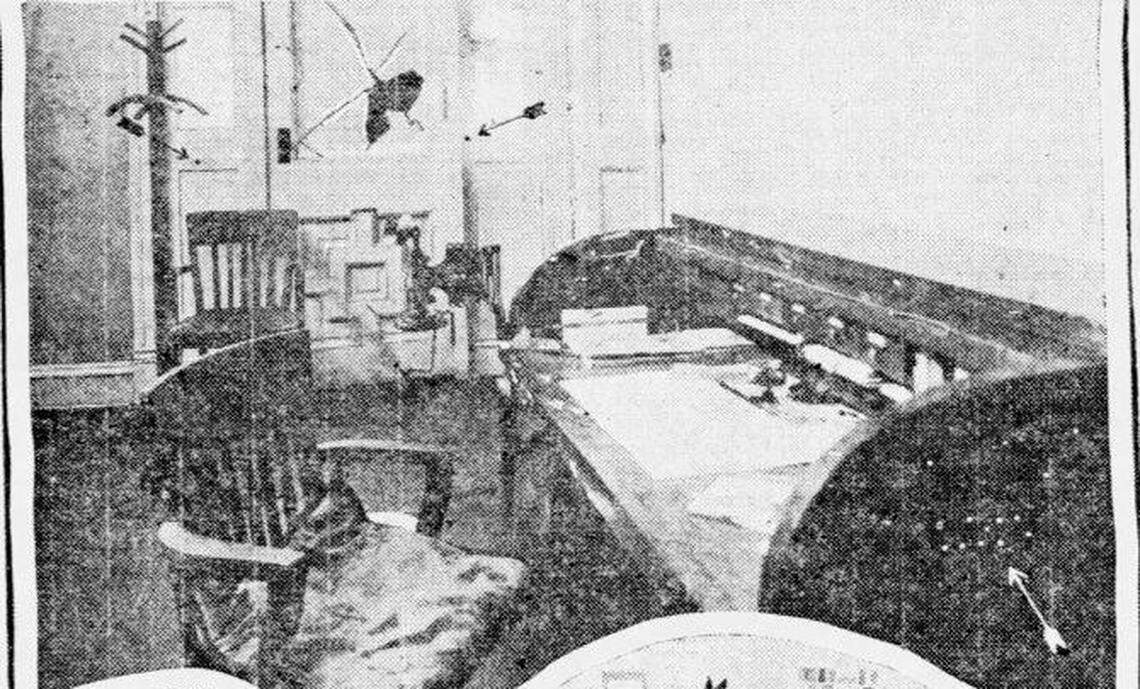 Fire and Police Commissioner Ed Parsley’s office, after he was killed by former Officer James Kidwell “Kid” Yates in 1917 and Yates was killed in a shootout with others. Arrows mark bullet holes in the walls and desk.