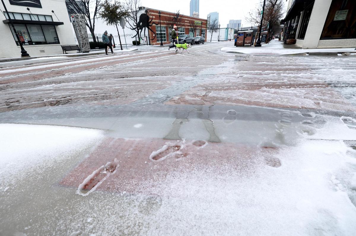 Snow and slush on South Main Street at the intersection of East Daggett Road on Thursday, Jan. 9, 2025, in Fort Worth.