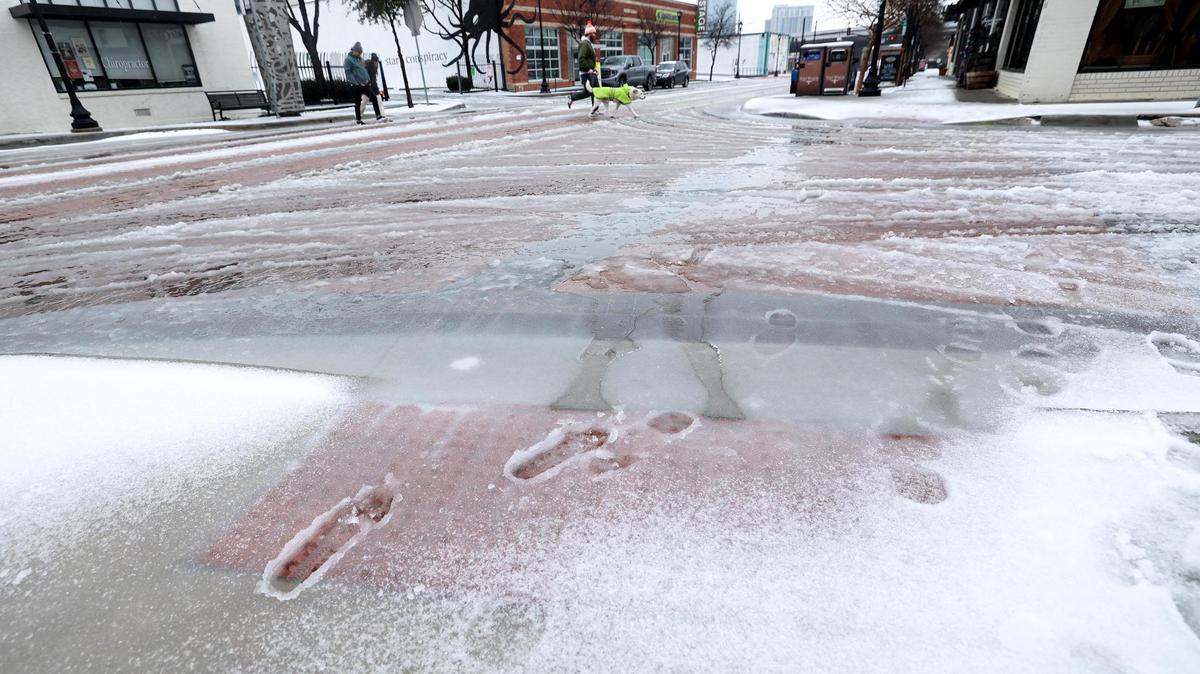 Snow and slush on South Main Street at the intersection of East Daggett Road on Thursday, Jan. 9, 2025, in Fort Worth.