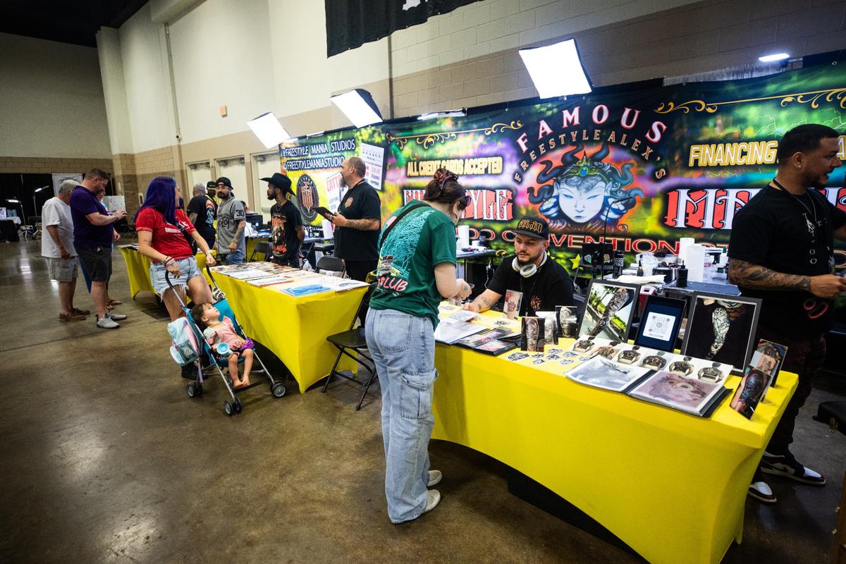 Attendees browse the various booths set up during Fort Worth Tattoo Arts Festival on Friday, June 7, 2024, at the Fort Worth Convention Center. The event held 223 booths and around 400 different artists.