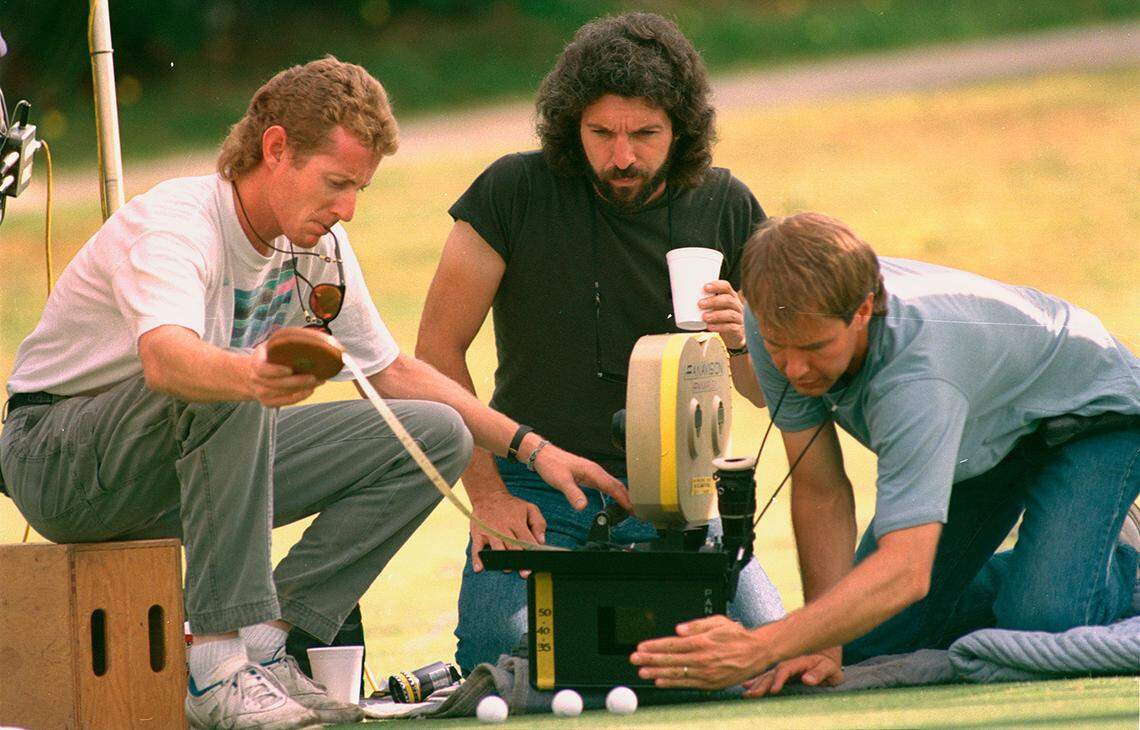 May 22, 1988: At Colonial Country Club, movie director Bobby Roth watches as Mark Karen, left, and Tim Suhretdet set up camera shots during filming of HBO’s “Dead Solid Perfect” starring Randy Quaid.