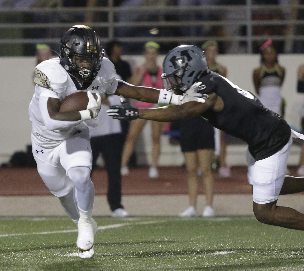 Mansfield’s Raymond Weaver breaks a tackle against Arlington Martin during their game on Thursday, September 11, 2025 at Maverick Stadium in Arlington Texas.