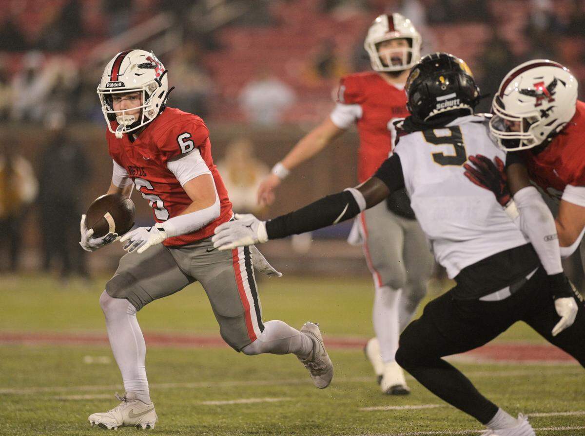 Argyle running back Watson Bell (6) avoids South Oak Cliff linebacker Jayden Shelton (9) in a Class 5A Division II state semifinal on Friday, Dec. 13, 2024 at Gerald J. Ford Stadium in University Park, Texas.